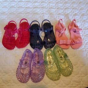 Jelly flats and sandals.